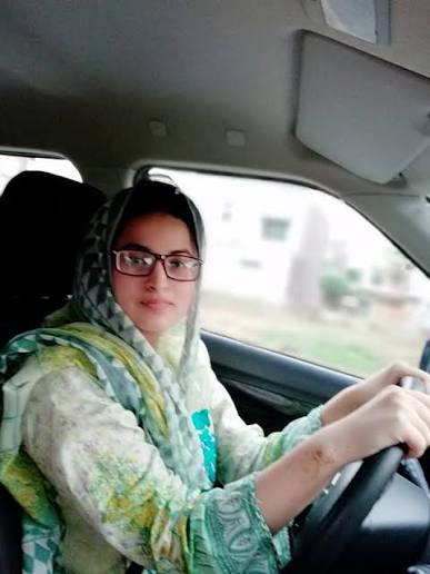 A female driving instructor at the wheel